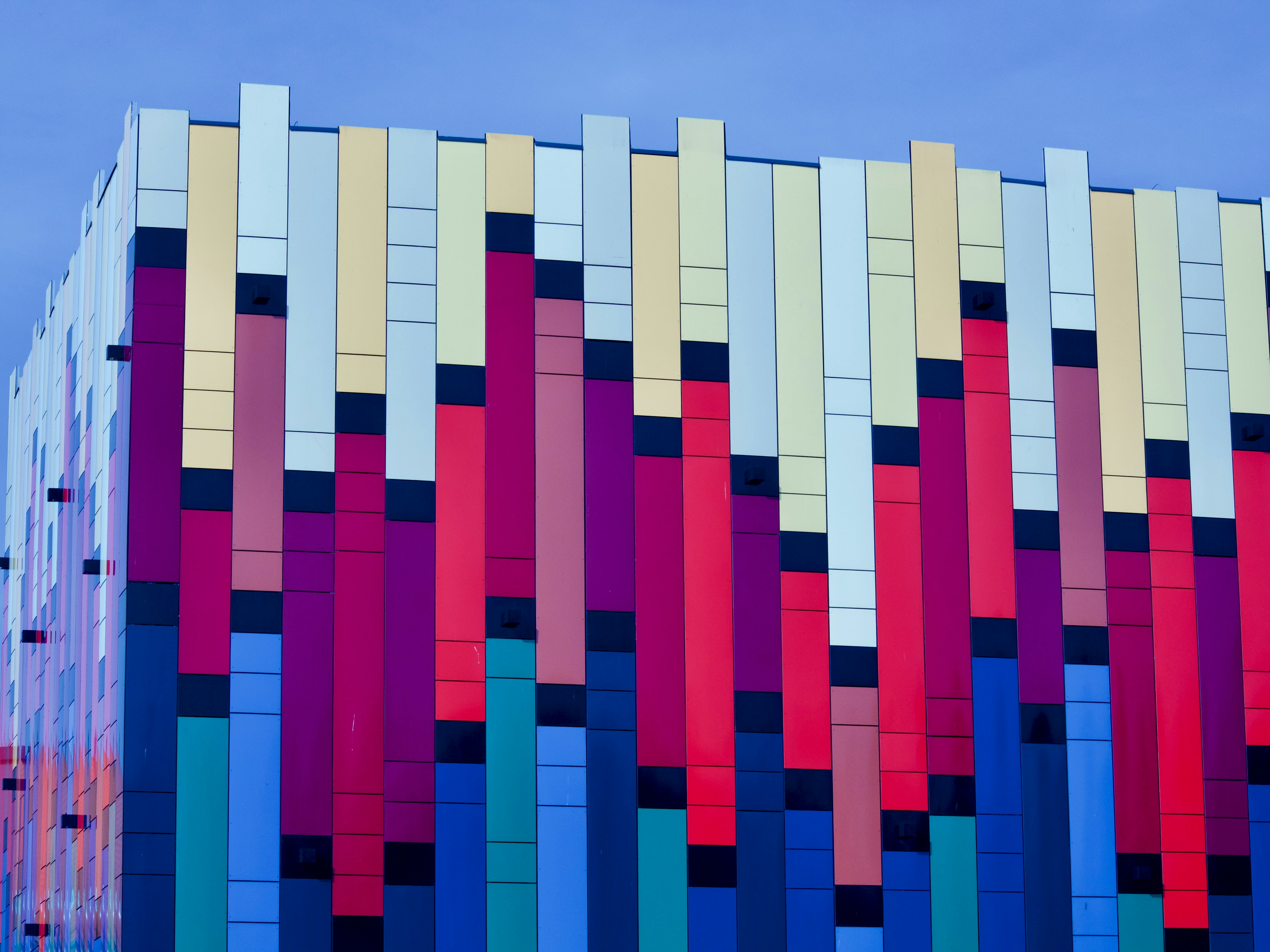 Mateusz Derks photography metal and glass architecture colorful - image from unsplash