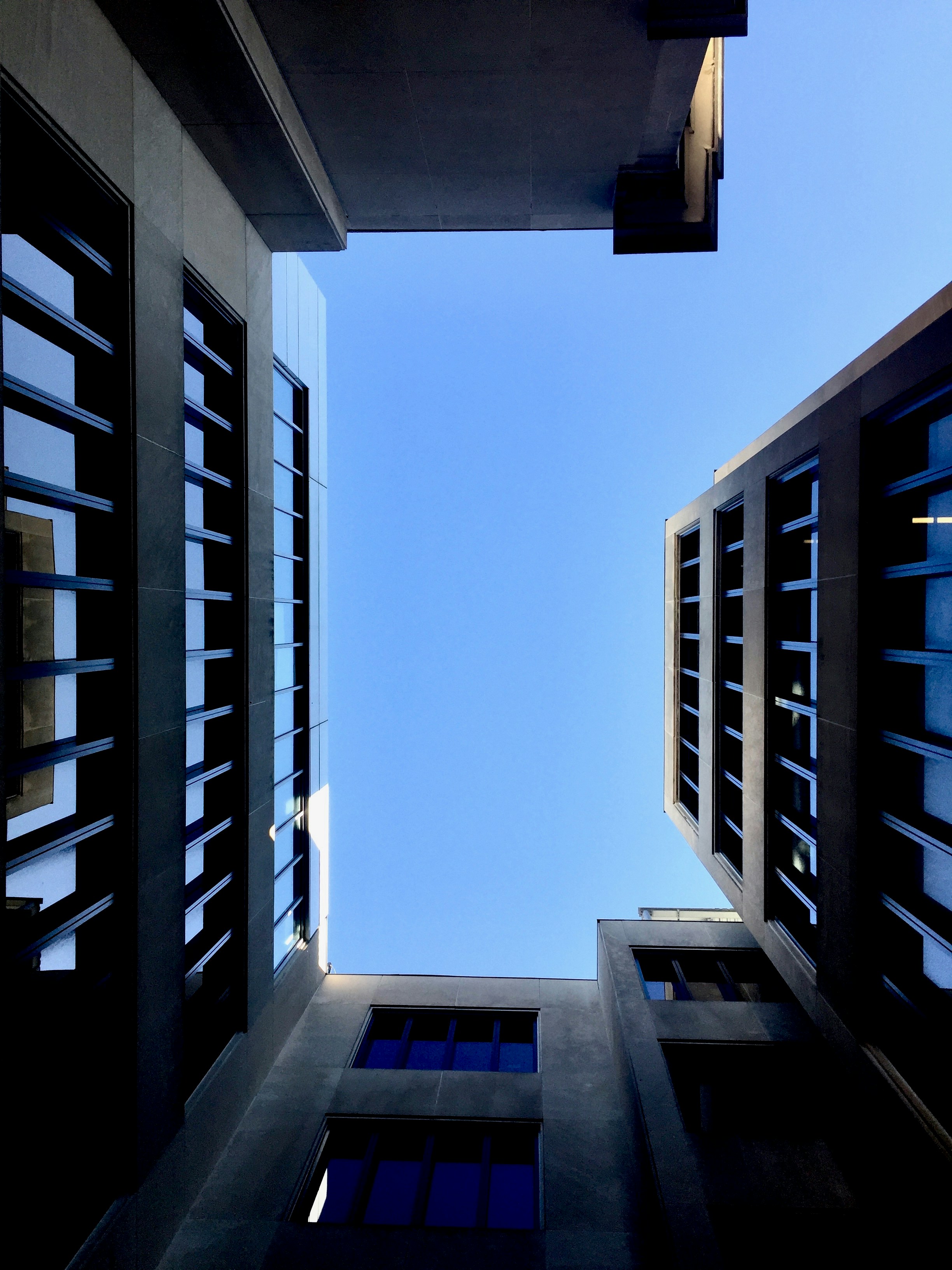 G Schwan on unsplash Upward-looking photo of a building on the campus of MIT (Massachusetts Institute of Technology) in Cambridge, MA, USA.